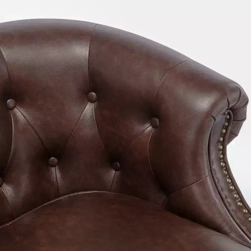 Fauteuil crapaud en similicuir capitonné