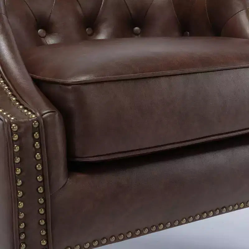 Fauteuil crapaud en similicuir capitonné
